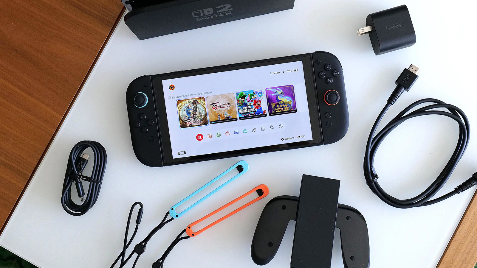 Комплектация Nintendo Switch 2. В наших краях понадобится переходник на блок питания. Фото: engadget.com Комплектация Nintendo Switch 2. В наших краях понадобится переходник на блок питания
